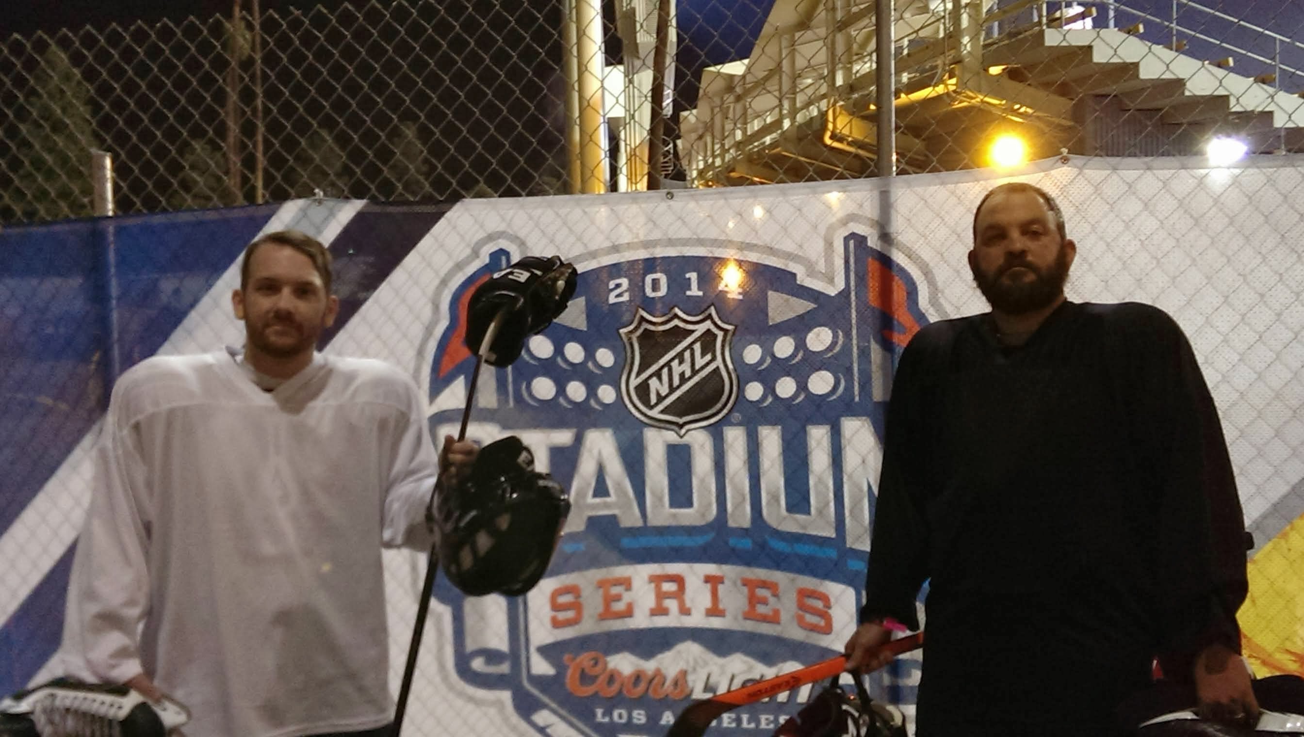 Joe and his buddy in front of the Stadium Series banner before the game